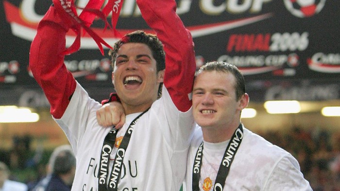 CARDIFF, UNITED KINGDOM - FEBRUARY 26: Cristiano Ronaldo (L) and Wayne Rooney of Manchester United celebrate with the trophy after winning the Carling Cup Final match between Manchester United and Wigan Athletic at the Millennium Stadium on February 26, 2006 in Cardiff, Wales. (Photo by Mike Hewitt/Getty Images)