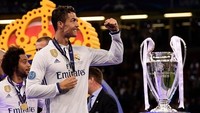 Begini salah satu pose Ronaldo usai menjuarai Liga Champions untuk kali keempat dalam kariernya. Pada 26 Mei mendatang, akan ada momen-momen lain Ronaldo di final Liga Champions. (Foto: Matthias Hangst/Getty Images)