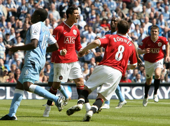 MANCHESTER, UNITED KINGDOM - MAY 05:  Cristiano Ronaldo (C) of Manchester United celebrates scoring a penalty during the Barclays Premiership match between Manchester City and Manchester United at the City of Manchester Stadium on May 5, 2007 in Manchester, England.  (Photo by Clive Brunskill/Getty Images)