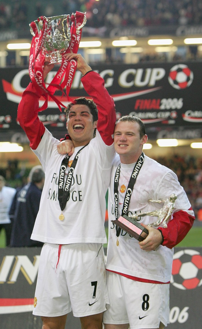 CARDIFF, UNITED KINGDOM - FEBRUARY 26: Cristiano Ronaldo (L) and Wayne Rooney of Manchester United celebrate with the trophy after winning the Carling Cup Final match between Manchester United and Wigan Athletic at the Millennium Stadium on February 26, 2006 in Cardiff, Wales. (Photo by Mike Hewitt/Getty Images)