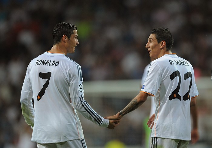 MADRID, SPAIN - OCTOBER 02:   Angel Di Maria (R) of Real Madrid CF celebrates with team-mate Cristiano Ronaldo after scoring their teams third goal during the UEFA Champions League match between Real Madrid CF and FC Copenhagen at Estadio Santiago Bernabeu on October 2, 2013 in Madrid, Spain.  (Photo by Denis Doyle/Getty Images)