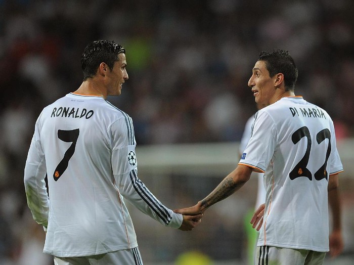 MADRID, SPAIN - OCTOBER 02:   Angel Di Maria (R) of Real Madrid CF celebrates with team-mate Cristiano Ronaldo after scoring their team's third goal during the UEFA Champions League match between Real Madrid CF and FC Copenhagen at Estadio Santiago Bernabeu on October 2, 2013 in Madrid, Spain.  (Photo by Denis Doyle/Getty Images)