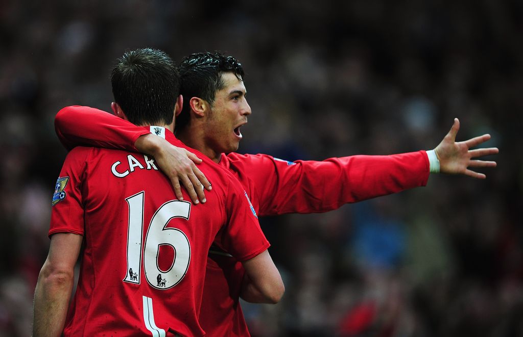 MANCHESTER, UNITED KINGDOM - MARCH 29:  Cristiano Ronaldo (R) of Man.Utd is congratulated by teammate, Michael Carrick after scoring the opening goal during the Barclays Premier League match between Manchester United and Aston Villa at Old Trafford on March 29, 2008 in Manchester, England.  (Photo by Shaun Botterill/Getty Images)