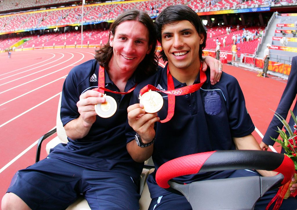 BEIJING - AUGUST 23: Argentinian forwards Lionel Messi (L) and Sergio Aguero  gold medal pose during the men's Olympic football tournament medal ceremony at the national stadium in Beijing during  the Men's Final between Nigeria and Argentina at the National Stadium on Day 15 of the Beijing 2008 Olympic Games on August 23, 2008 in Beijing, China. (Photo by Koji Watanabe/Getty Images)