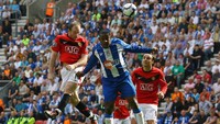 Rooney juga jago di udara -- ia mencetak 30 gol buat MU lewat sundulan. Salah satunya adalah gawang Wigan pada Agustus 2009. (Foto: Alex Livesey/Getty Images)