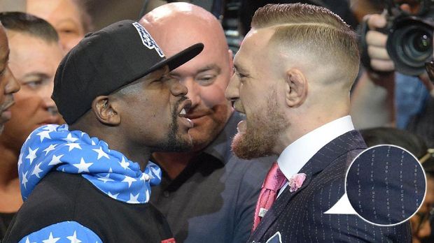 Conor McGregor pernah menggunakan jas bermotif garis, namun bertuliskan makian.