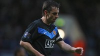 Gary Neville dipercaya memimpin rekan-rekannya di MU pada 2005-2011. Selama dia menjadi kapten, MU memenangi tujuh trofi, termasuk dua titel Premier League dan satu gelar Liga Champions. Foto: Getty Images/Richard Heathcote