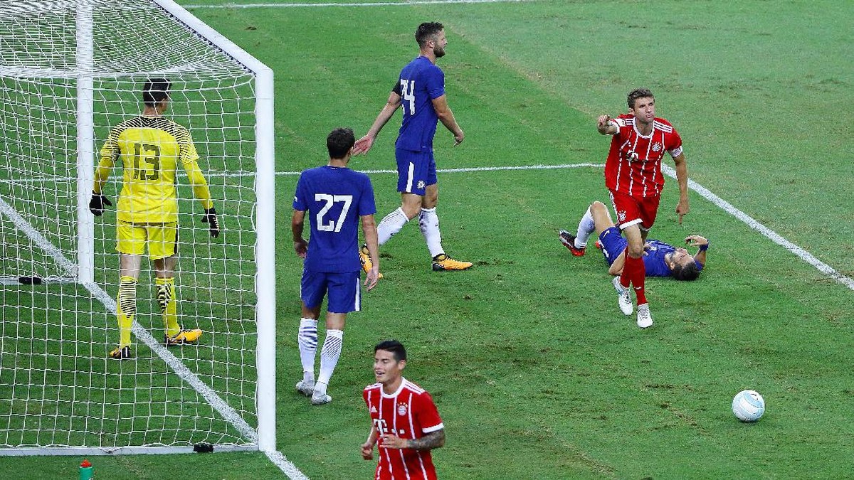 Thomas Mueller merayakan golnya ke gawang Chelsea (Suhaimi Abdullah/Getty Images for ICC)