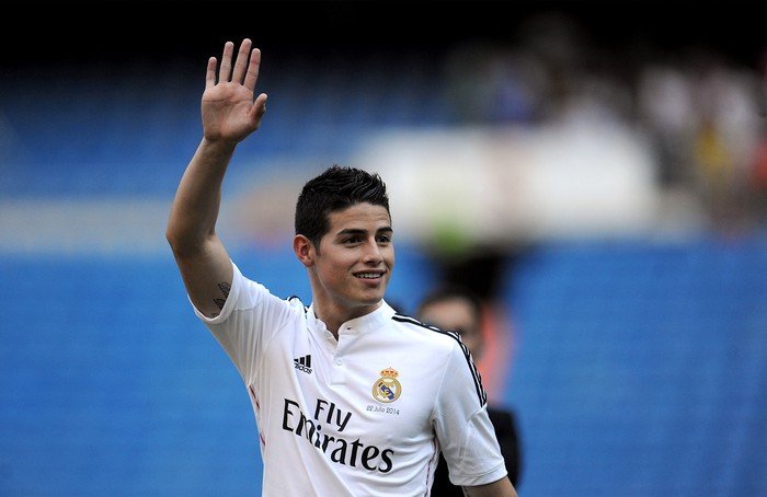 MADRID, SPAIN - JULY 22:  James Rodriguez waves to fans during his unveiling as a new Real Madrid player at the Santaigo Bernabeu stadium on July 22, 2014 in Madrid, Spain. Real agreed to buy Rodriguez from AS Monaco for the next six seasons for an undisclosed transfer fee.  (Photo by Denis Doyle/Getty Images)