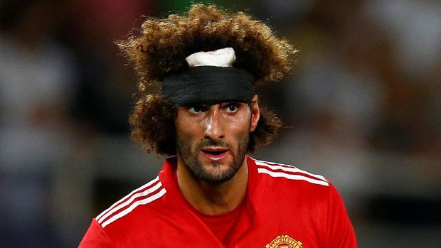 Kerja keras Marouane Fellaini mulai berbuah pujian dari pendukung Manchester United.