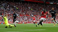 Gol perdana dia di Premier League dalam seragam MU tercipta saat pertandingan memasuki menit 33. Sepakannya sempat mengenai tiang untuk kemudian masuk ke gawang. (Foto: Reuters / Andrew Yates)
