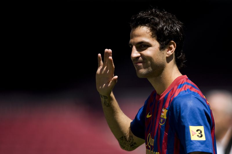 BARCELONA, SPAIN - AUGUST 15:  Cesc Fabregas poses for the photographers during his presentation as the new signing for FC Barcelona at Camp Nou sports complex on August 15, 2011 in Barcelona, Spain.  (Photo by David Ramos/Getty Images)