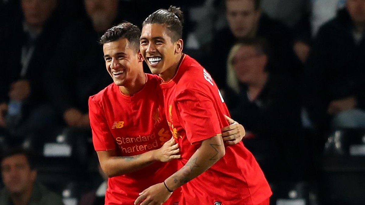 Roberto Firmino tak siap kehilangan Philippe Coutinho. Foto: Richard Heathcote/Getty Images