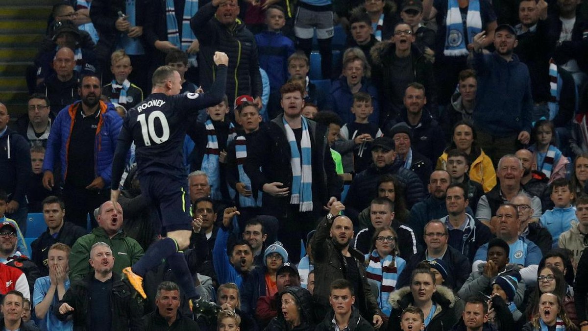 Wayne Rooney merayakan golnya ke gawang Manchester City (Phil Noble/Reuters)