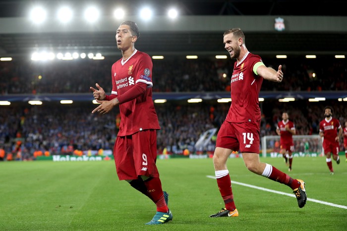 LIVERPOOL, ENGLAND - AUGUST 23: Roberto Firmino of Liverpool celebrates scoring his sides fourth goal with Jordan Henderson of Liverpool during the UEFA Champions League Qualifying Play-Offs round second leg match between Liverpool FC and 1899 Hoffenheim at Anfield on August 23, 2017 in Liverpool, United Kingdom.  (Photo by Mark Robinson/Getty Images)