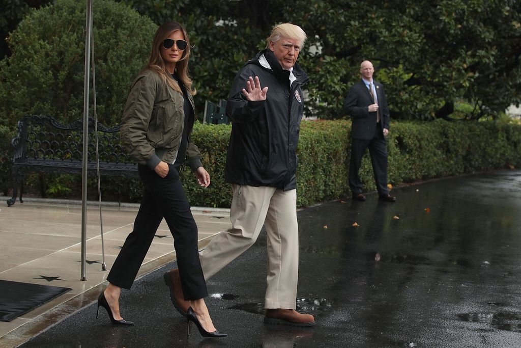 WASHINGTON, DC - AUGUST 29:  U.S. President Donald Trump walks with first lady Melania Trump prior to their Marine One departure from the White House August 29, 2017 in Washington, DC. President Trump was traveling to Texas to observe the Hurricane Harvey relief efforts.  (Photo by Alex Wong/Getty Images)