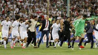 Timnas Iran jadi negara kedua sekaligus yang pertama dari Asia yang lolos ke Piala Dunia 2018. Mereka lolos sebagai juara grup tanpa terkalahkan (ATTA KENARE/AFP)
