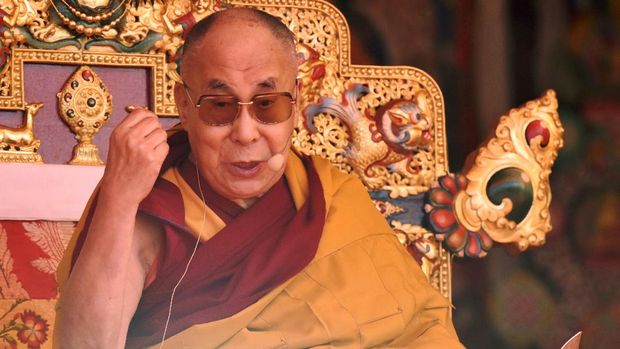 Exiled Tibetan spiritual leader the Dalai Lama speaks at the Yiga Choezin ground in the district of Tawang in India's north-eastern state of Arunachal Pradesh on April 9, 2017.The Dalai Lama is visiting Arunachal Predesh on the Indo-Chinese border, where he first arrived in India after fleeing Tibet. / AFP PHOTO / Biju BORO