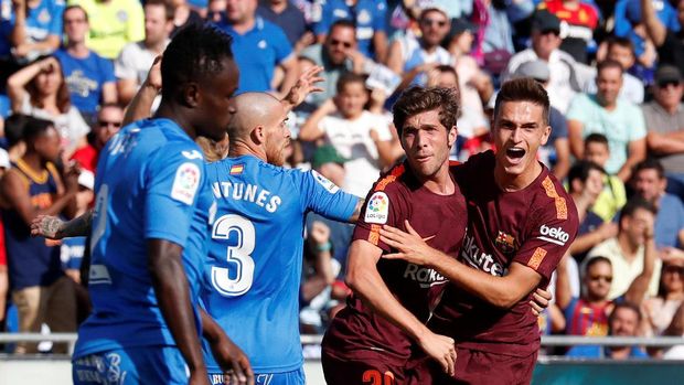 Denis Suarez memecah kebuntuan dengan mencetak gol penyama kedudukan Barcelona 1-1 di markas Getafe
