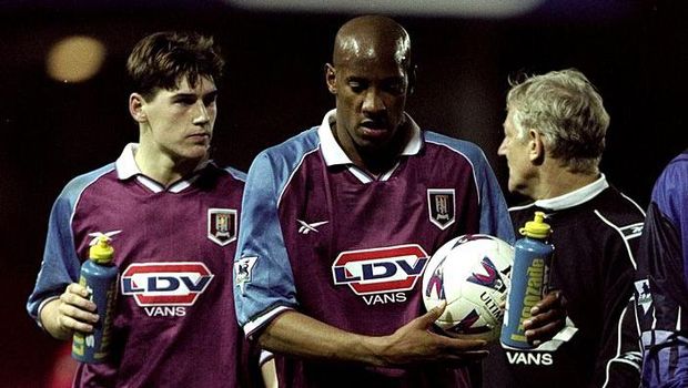Hat-trick, Dion Dublin, Aston Villa 14 Nov 1998: Dion Dublin of Aston Villa walks from the field of play with the match ball after scoring a hat-trick closely followed by team-mate Gareth Barry during the FA Carling Premiership match against Southampton played at the Dell in Southampton,England. The match finished in a comprehensive 1-4 win for the visitors Aston Villa. Mandatory Credit: Phil Cole /Allsport