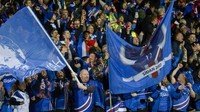 Kelolosan itu tentu saja disambut meriah oleh para penggemar setia Islandia di stadion Laugardalsvollur. (Foto: Haraldur Gudjonsson / AFP)