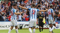 Huddersfield meraih lima poin dari empat laga kandangnya sejauh ini. Secara keseluruhan punya sembilan poin di Premier League 2017/2018. (Foto: David Rogers/Getty Images)