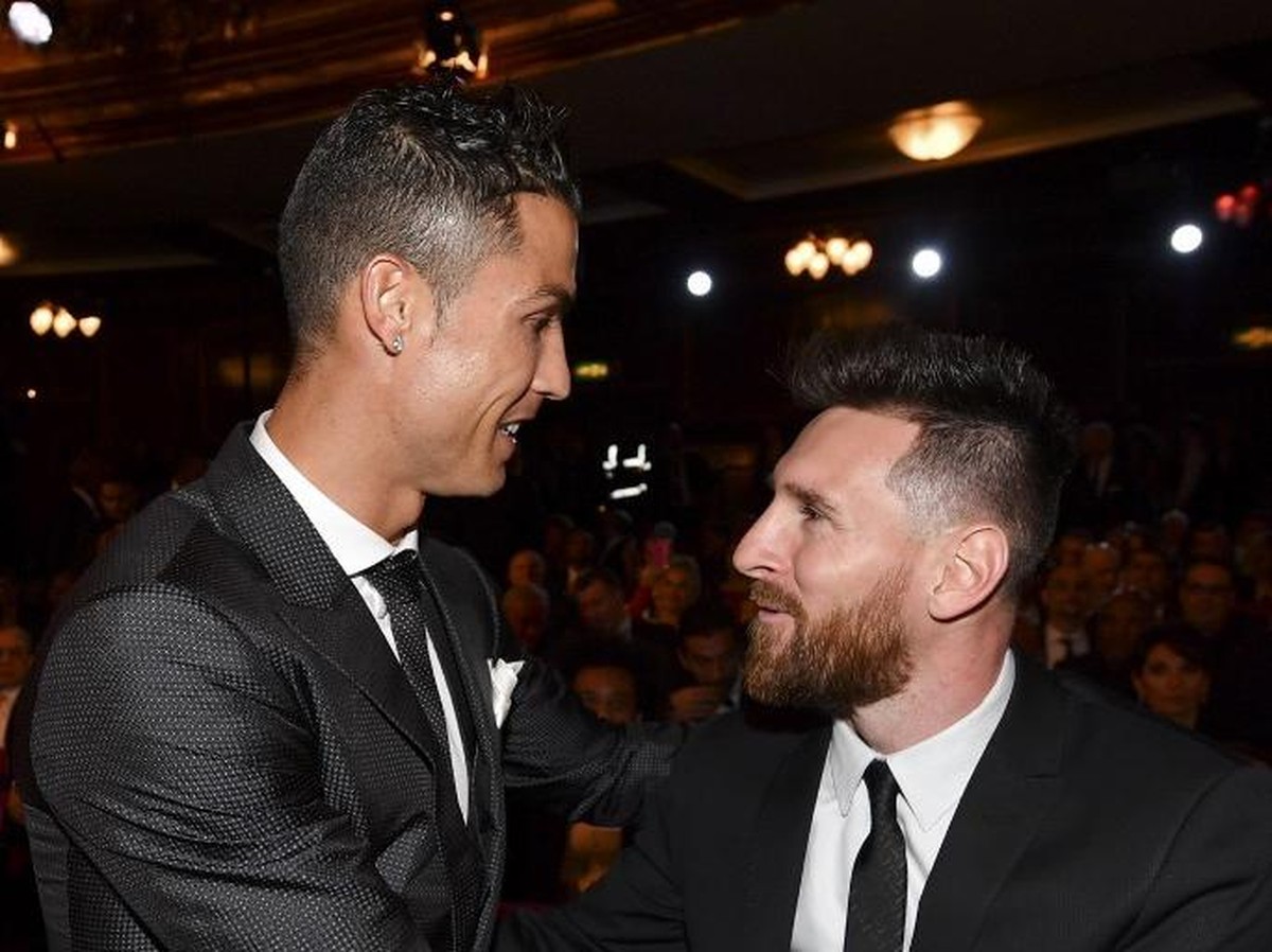 Cristiano Ronaldo dan Lionel Messi menciptakan rivalitas yang tak pernah ada sebelumnya di La Liga (AFP PHOTO / Ben STANSALL)