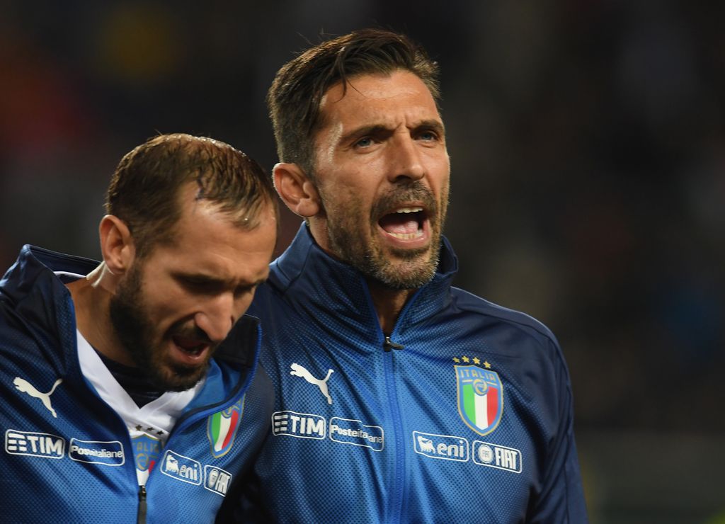 TURIN, ITALY - OCTOBER 06:  (R-L) Gianluigi Buffon and Giorgio Chiellini of  Italy sing their national anthem prior to the FIFA 2018 World Cup Qualifier between Italy and FYR Macedonia at Stadio Olimpico on October 6, 2017 in Turin, Italy .  (Photo by Claudio Villa/Getty Images)