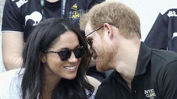 TORONTO, ON - SEPTEMBER 25: Prince Harry (R) and Meghan Markle (L) attend a Wheelchair Tennis match during the Invictus Games 2017 at Nathan Philips Square on September 25, 2017 in Toronto, Canada   Chris Jackson/Getty Images for the Invictus Games Foundation /AFP