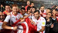 Tunisia juga berhasil ambil bagian di Rusia. Hasil imbang di laga pamungkas melawan Libya pada 11 November 2017, yang memastikan kelolosan mereka. (Foto: Fethi Belaid/AFP)