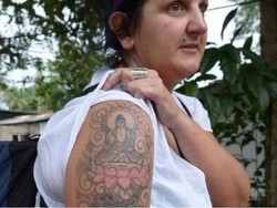 Ditahan karena Bertato Buddha, Wanita ini Dapat Ganti Rugi Rp 70 Juta