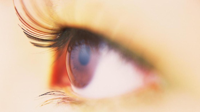 Beautiful blond woman with painted eye
