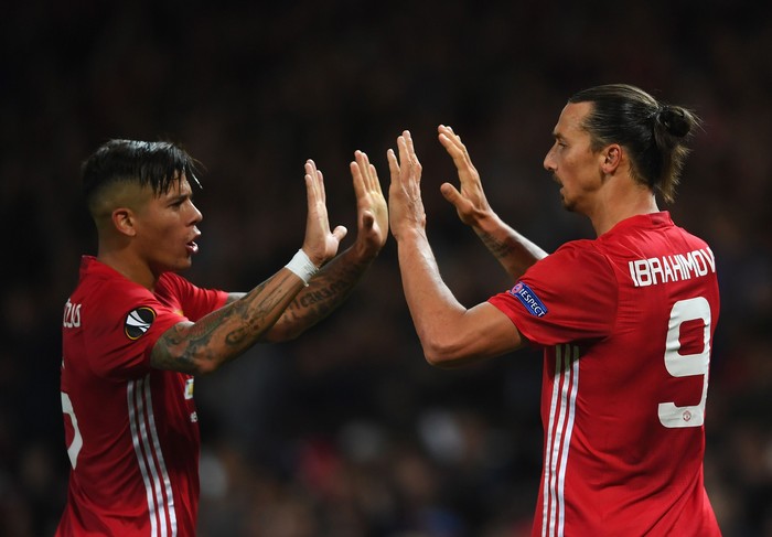 MANCHESTER, ENGLAND - SEPTEMBER 29:  Zlatan Ibrahimovic of Manchester United is congratulated by teammate Marcos Rojo after scoring the opening goal during the UEFA Europa League group A match between Manchester United FC and FC Zorya Luhansk at Old Trafford on September 29, 2016 in Manchester, England.  (Photo by Laurence Griffiths/Getty Images)