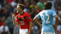 Demikian juga dengan Michael Owen yang merayakan gol ke gawang City di detik-detik akhir pada musim 2009/2010. MU saat itu menang dramatis 4-3. (Alex Livesey/Getty Images)