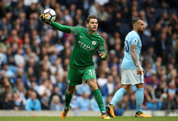 MANCHESTER, ENGLAND - OCTOBER 17: John Stones of Manchester City congratulats Ederson of Manchester City after saving a penalty during the UEFA Champions League group F match between Manchester City and SSC Napoli at Etihad Stadium on October 17, 2017 in Manchester, United Kingdom.  (Photo by Gareth Copley/Getty Images)