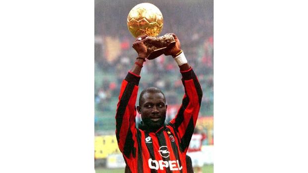 Milan's Liberian player George Weah holds up the Golden Ball award he recently received after the Italian league match between Milan and Sampdoria 07 January. Milan won 3-0.     AFP PHOTO / AFP PHOTO / CARLO FERRARO