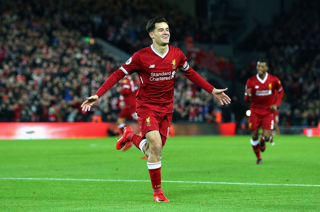 LIVERPOOL, ENGLAND - DECEMBER 26:  Philippe Coutinho of Liverpool scores his sides first goal during the Premier League match between Liverpool and Swansea City at Anfield on December 26, 2017 in Liverpool, England.  (Photo by Jan Kruger/Getty Images)