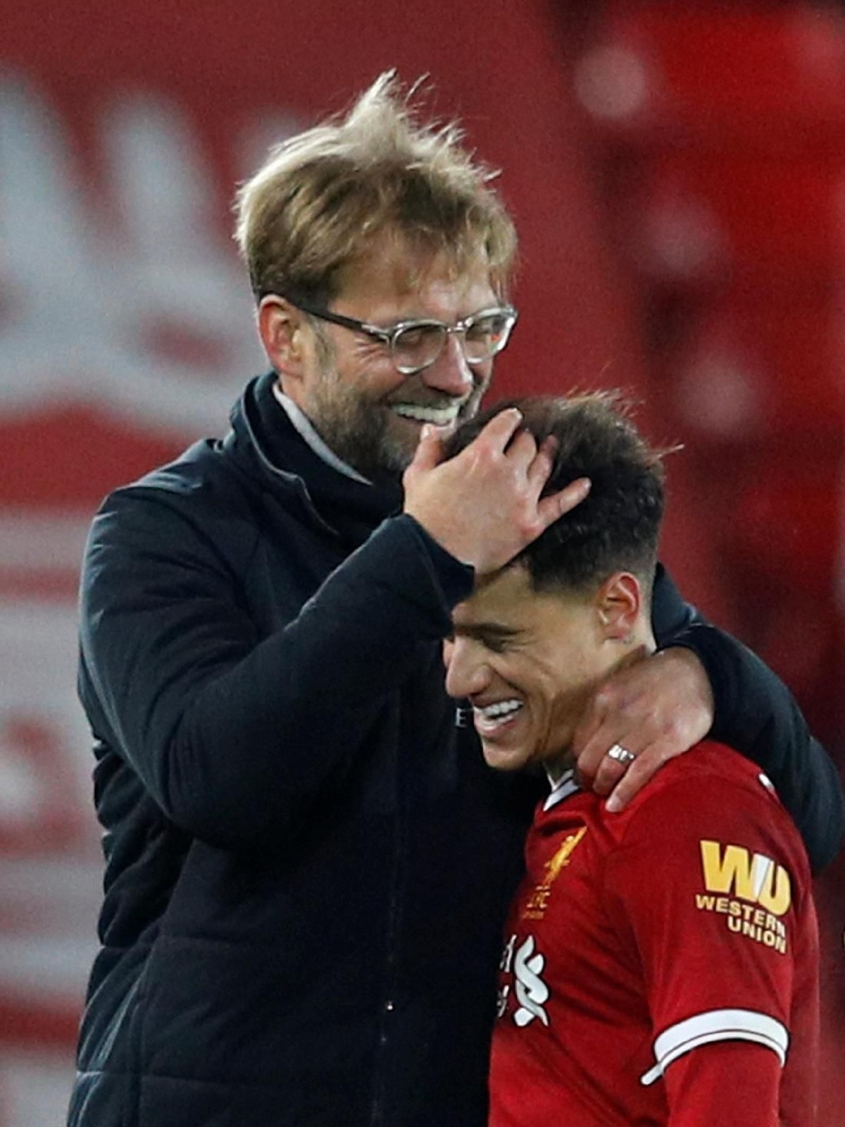 Juergen Klopp dan Philippe Coutinho (Phil Noble/Reuters)