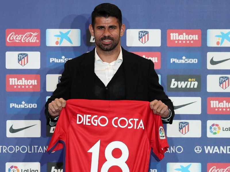 Atletico Madrid's soccer player Diego Costa poses with his jersey for the media at Wanda Metropolitano stadium in Madrid, Spain, December 31, 2017. REUTERS/Susana Vera