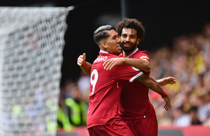 WATFORD, ENGLAND - AUGUST 12:  Mohamed Salah of Liverpool celebrates scoring his sides third goal with Roberto Firmino of Liverpool during the Premier League match between Watford and Liverpool at Vicarage Road on August 12, 2017 in Watford, England.  (Photo by Alex Broadway/Getty Images)