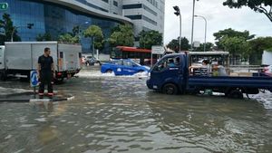 Foto: Banjir Landa Singapura Usai Hujan Deras