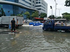 Foto: Banjir Landa Singapura Usai Hujan Deras