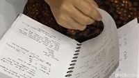 Ini Isi Buku Hitam yang Dibaca Novanto Sebelum Sidang