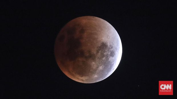 Fase gerhana bulan yang terlihat di kawasan Monas Jakarta,  31 Januari 2018. terlih Fenomena gerhana 