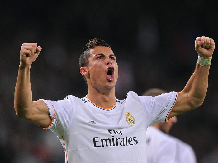 MADRID, SPAIN - OCTOBER 30:  Cristiano Ronaldo of Real Madrid CF celebrates after scoring Real's 6th goal during the La Liga match between Real Madrid CF and Sevilla FC at the Santiago Bernabeu Stadium on October 30, 2013 in Madrid, Spain.  (Photo by Denis Doyle/Getty Images)