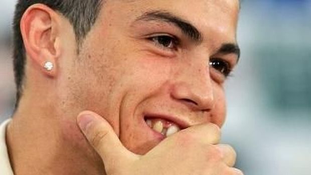 Portuguese player Cristiano Ronaldo smiles during a press conference, 22 June 2004, at the Academia Sporting, near Lisbon during the European Nations Championship.Portugal will play against England 24 June in Lisbon for the Euro 2004. AFP PHOTO/Lluis GENE / AFP PHOTO / LLUIS GENE