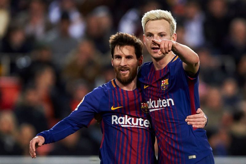 VALENCIA, SPAIN - FEBRUARY 08:  Ivan Rakitic of FC Barcelona celebrates with Lionel Messi after scoring his team's second goal during the Copa de Rey semi-final second leg match between Valencia and Barcelona on February 8, 2018 in Valencia, Spain.  (Photo by Manuel Queimadelos Alonso/Getty Images)