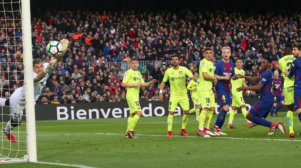 Getafe mampu menahan gempuran pemain-pemain Barcelona.