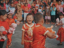 Red vibe in the laughter of children