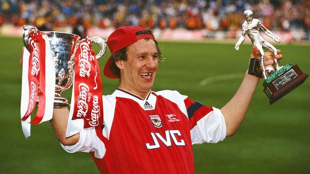 LONDON, UNITED KINGDOM - APRIL 18: Arsenal player Paul Merson with the League Cup and man of the match trophy after the 1993 Coca-Cola Cup Final between Arsenal and Sheffield Wednesday at Wembley on April 18, 1993 in London, England. (Photo by Allsport/Getty Images)